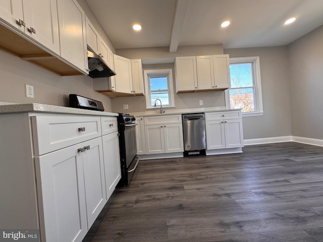 kitchen featuring dark wood-type flooring, white cabinets, range with gas stovetop, light countertops, and stainless steel dishwasher