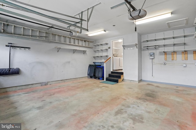 garage featuring washer / clothes dryer and a garage door opener