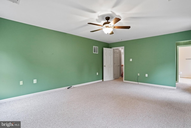 empty room featuring visible vents, baseboards, ceiling fan, and carpet flooring