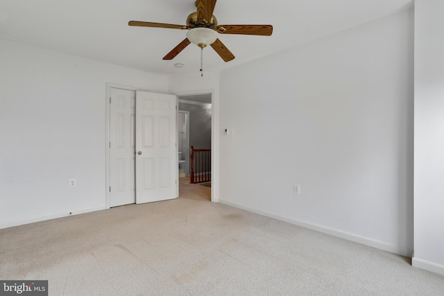 interior space featuring ceiling fan and baseboards