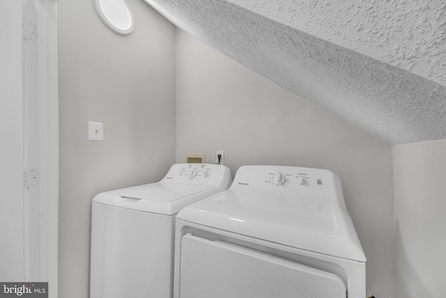 laundry room featuring laundry area and washing machine and clothes dryer