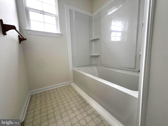 full bath featuring tile patterned floors and baseboards