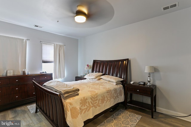 bedroom with visible vents, ceiling fan, light wood-type flooring, and baseboards