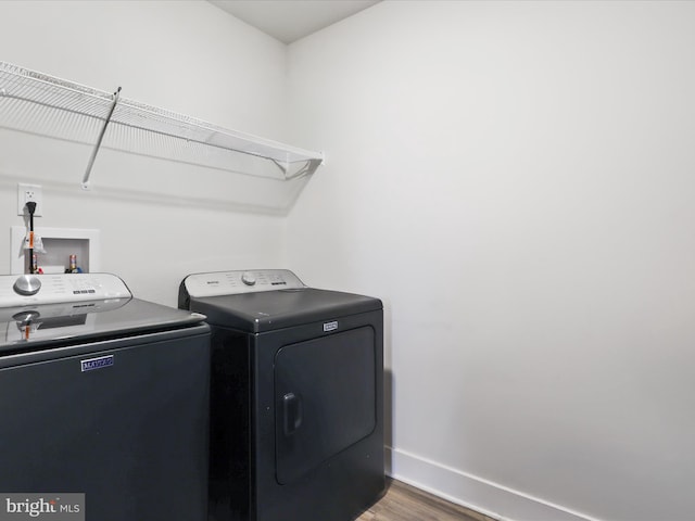 196 Kelley Rd, Fredericksburg, VA 22405 - washroom featuring baseboards, wood finished floors, laundry area, and washer and clothes dryer