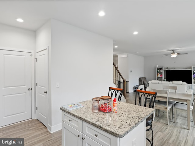 196 Kelley Rd, Fredericksburg, VA 22405 - kitchen with a ceiling fan, a kitchen island, white cabinetry, recessed lighting, and light wood-style floors
