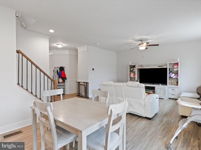 196 Kelley Rd, Fredericksburg, VA 22405 - dining space with visible vents, light wood-style flooring, a ceiling fan, and stairway
