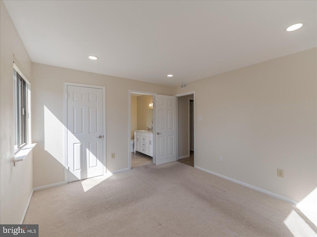 unfurnished bedroom with recessed lighting, carpet, and baseboards