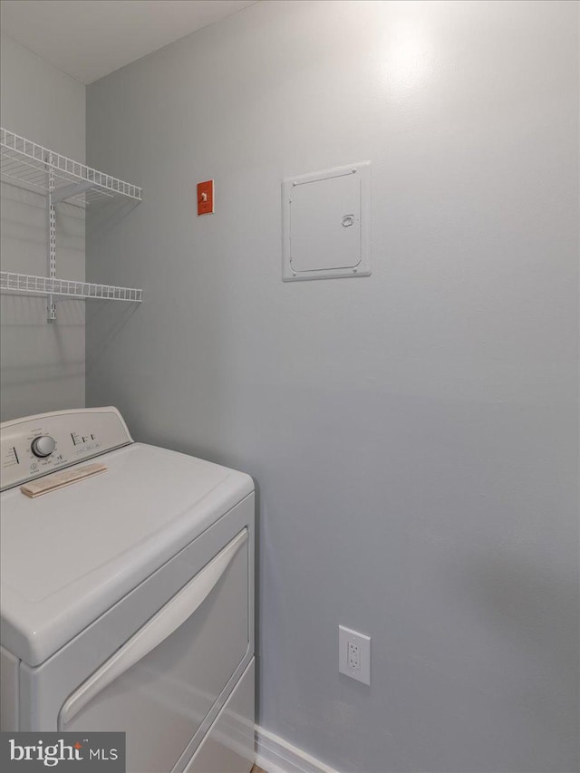 clothes washing area featuring laundry area and washer / clothes dryer