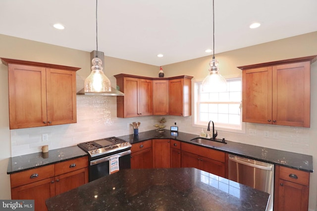 kitchen with brown cabinetry, a sink, stainless steel appliances, pendant lighting, and tasteful backsplash