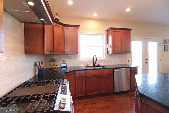 kitchen featuring under cabinet range hood, dishwasher, stovetop, decorative backsplash, and a sink