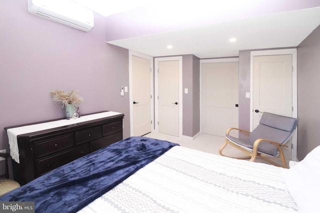 bedroom featuring a closet, recessed lighting, and a wall mounted AC