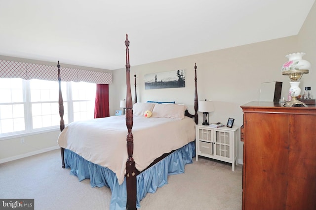 bedroom featuring baseboards and carpet floors