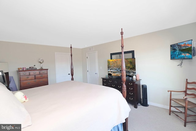 bedroom featuring visible vents, baseboards, and carpet floors