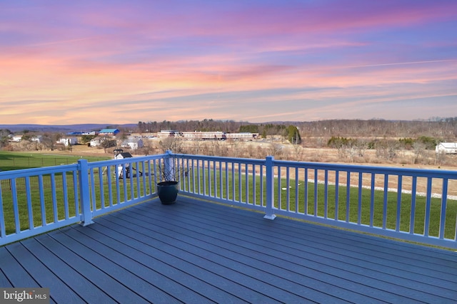 wooden deck with a lawn