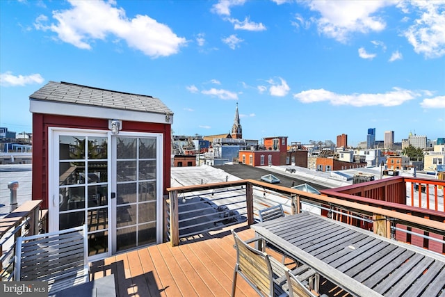 wooden deck with a view of city