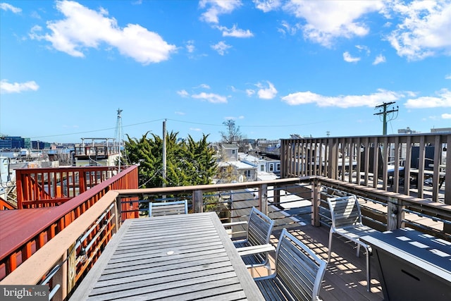 wooden deck featuring outdoor dining space