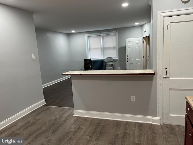 kitchen with tile countertops, baseboards, dark wood-type flooring, and recessed lighting