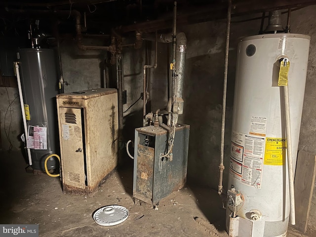 utility room with gas water heater and a heating unit