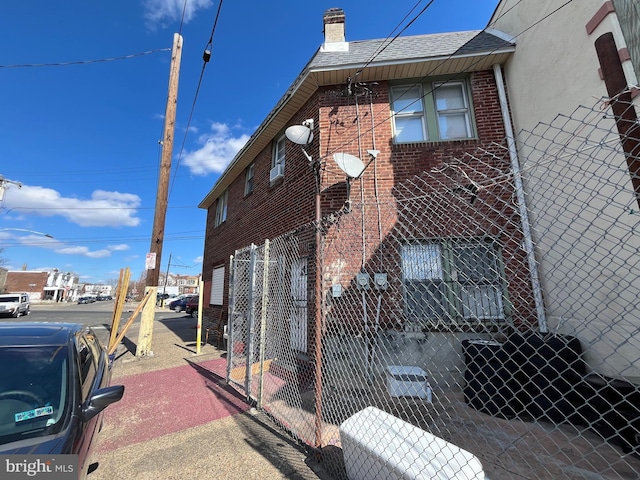 view of building exterior with fence