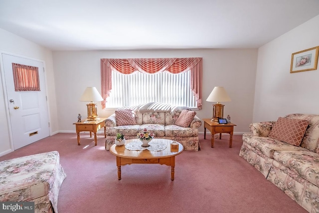 carpeted living room with baseboards