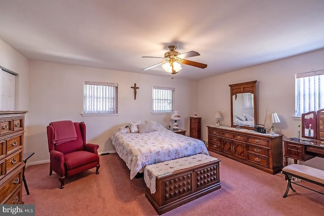 bedroom with baseboards, light colored carpet, and ceiling fan