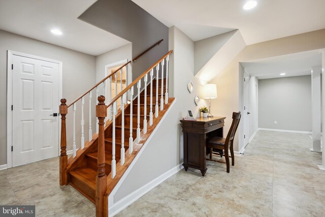 stairway featuring recessed lighting and baseboards