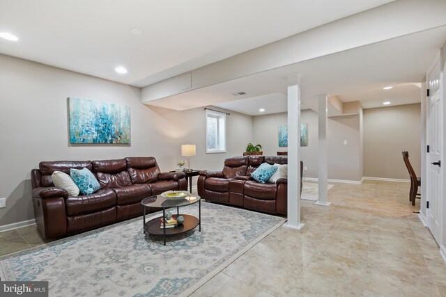 living area with recessed lighting and baseboards