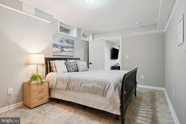 bedroom featuring baseboards