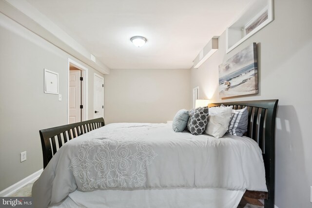 bedroom featuring baseboards