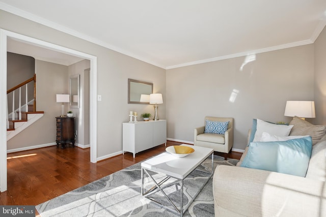 living room with stairway, ornamental molding, baseboards, and wood finished floors