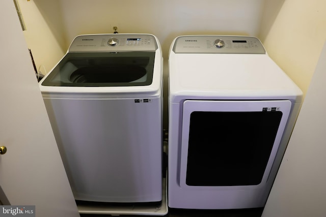 laundry area featuring laundry area and separate washer and dryer