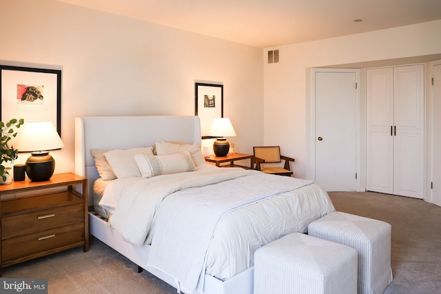 bedroom with light colored carpet and visible vents