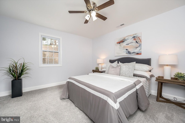 bedroom featuring visible vents, ceiling fan, light carpet, and baseboards