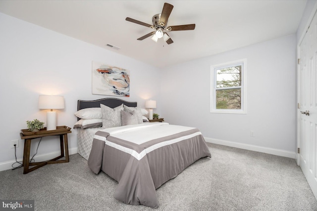 bedroom featuring light colored carpet, visible vents, and baseboards