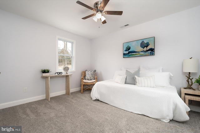 carpeted bedroom with baseboards, visible vents, and a ceiling fan