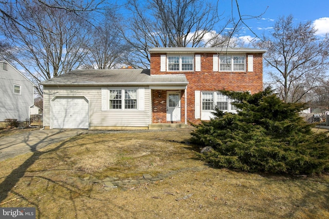 view of front of house with a garage, brick siding, and driveway