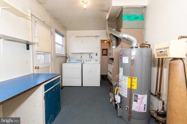 interior space featuring washing machine and dryer, gas water heater, dark carpet, and laundry area