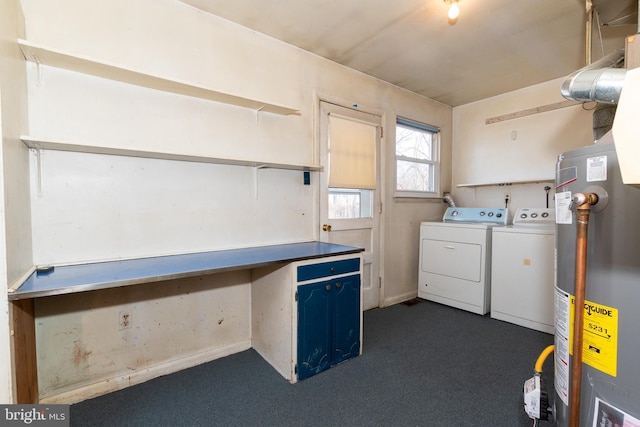 laundry area with dark colored carpet, laundry area, washer and clothes dryer, and gas water heater