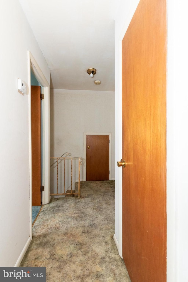 corridor with carpet floors