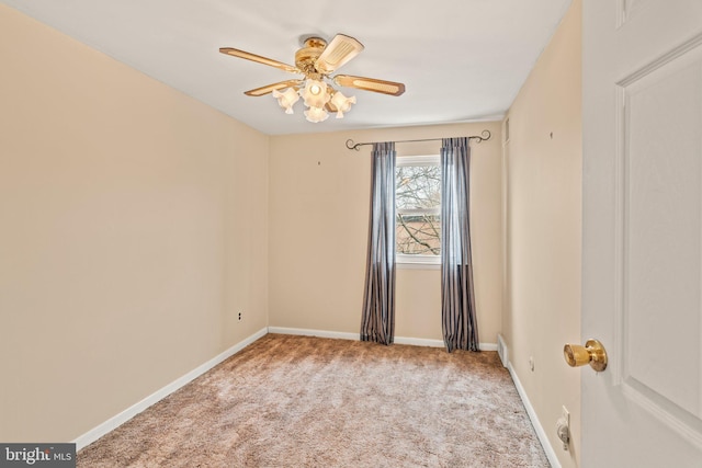 spare room featuring baseboards, carpet floors, and ceiling fan