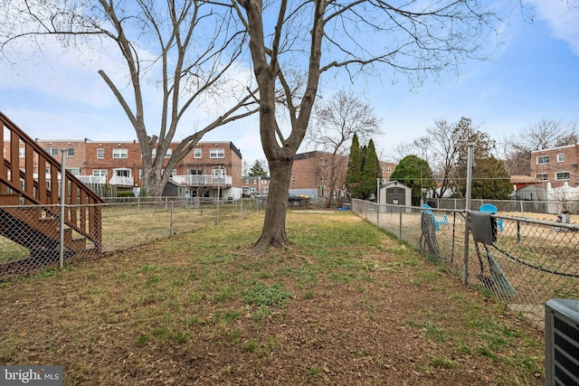 view of yard with a residential view and fence