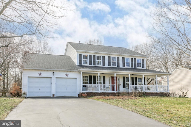 view of front of property featuring an attached garage, covered porch, a shingled roof, driveway, and a front yard