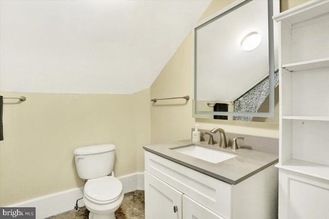 half bath featuring vanity, lofted ceiling, toilet, and baseboards