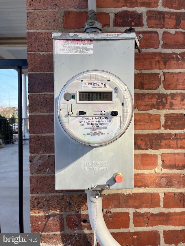 exterior details with electric meter and brick siding