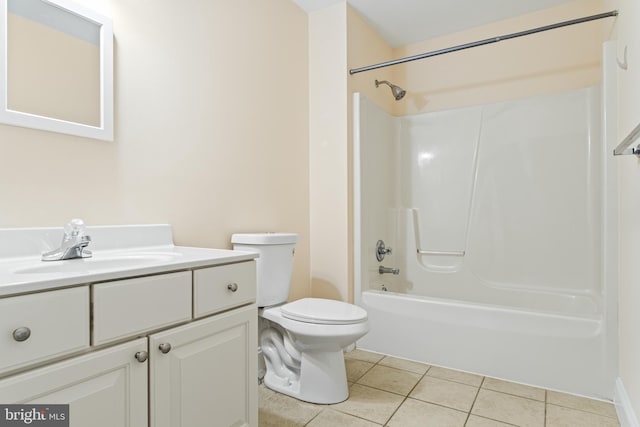 bathroom featuring vanity, bathtub / shower combination, tile patterned flooring, and toilet