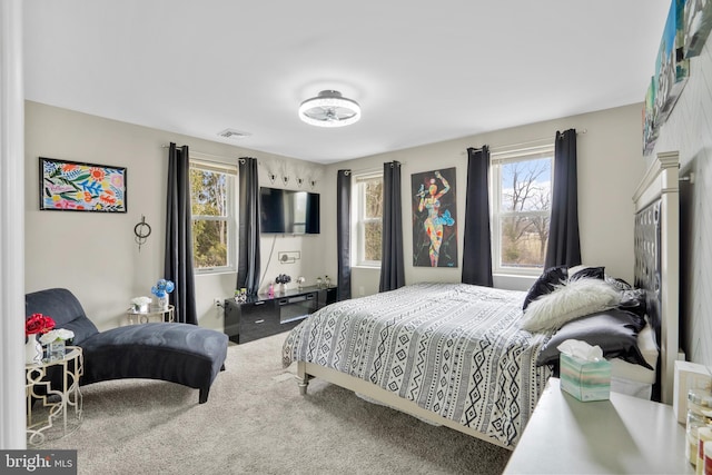 bedroom with carpet and visible vents