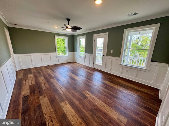 419 Kentmorr Rd, Stevensville, MD 21666 - unfurnished room with a ceiling fan, crown molding, wainscoting, dark wood-type flooring, and plenty of natural light