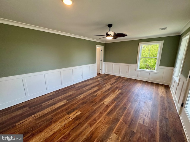 419 Kentmorr Rd, Stevensville, MD 21666 - unfurnished room with ornamental molding, dark wood-type flooring, ceiling fan, wainscoting, and a decorative wall
