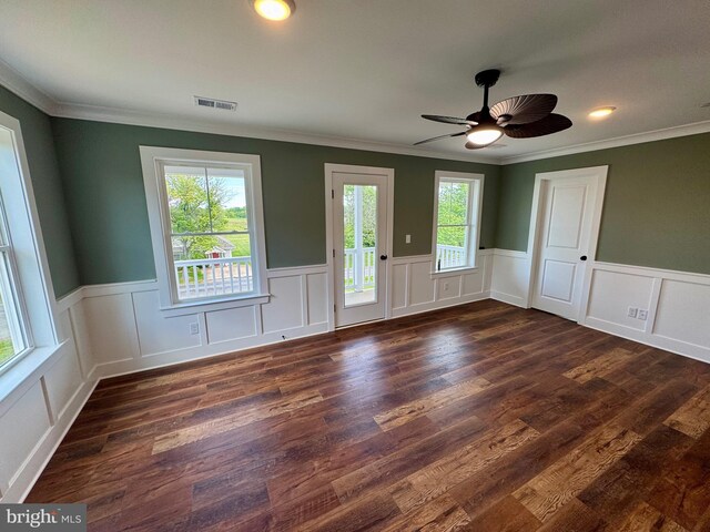 419 Kentmorr Rd, Stevensville, MD 21666 - unfurnished room with wainscoting, crown molding, dark wood-style flooring, ceiling fan, and a decorative wall
