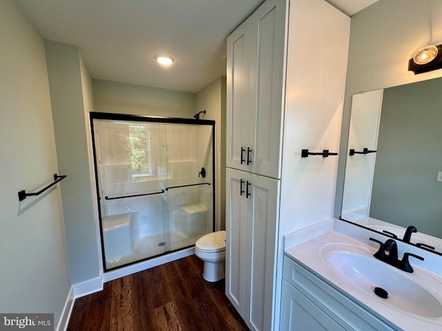 419 Kentmorr Rd, Stevensville, MD 21666 - bathroom featuring a shower stall, wood finished floors, toilet, and vanity